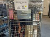 a cage with a bunch of items inside of it