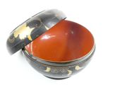 a bowl with a lid that has a design on it