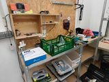 a workbench with tools on it in a room