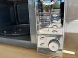 a microwave that is sitting on a counter in a kitchen
