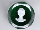 a glass paperweight with a picture of a woman on it