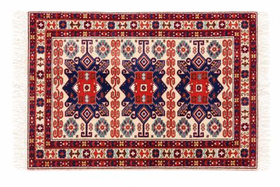 a red, blue and white rug with geometric design