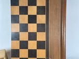 a chess board on a table with a box of black and white chess pieces