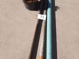 two baseball bats and a ball on the ground