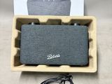 a close up of a box with a speaker in it