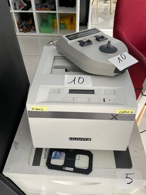 a game controller sitting on top of a stack of boxes