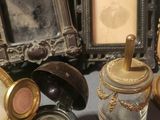 a lot of antique items that are sitting on a table