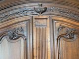 an image of a large wooden armoire with carvings on it