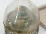a bottle that has some kind of liquid inside of it