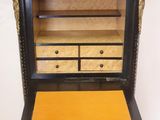 an old wooden cabinet with drawers and drawers on top of it