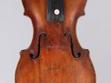 an old violin with a black bow on a white background