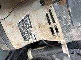 a close up of a motor bike with a sticker on it