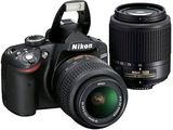 two cameras with lenses and a lens on a white background