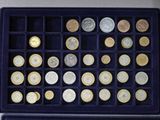 a box of coins that are sitting on a table