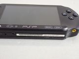 a close up of a black game system on a table