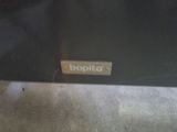 a close up of a black suitcase with a name tag on it