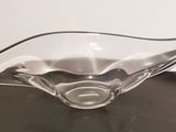 a glass bowl that is sitting on a table
