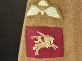 a close up of a military uniform with a badge on it