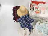 a box of clothes and a hat sitting on a table