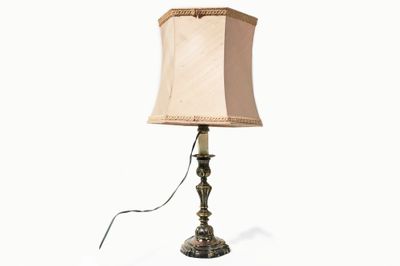 a lamp that is on a table with a white background