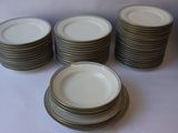 a lot of plates stacked on top of each other on a table