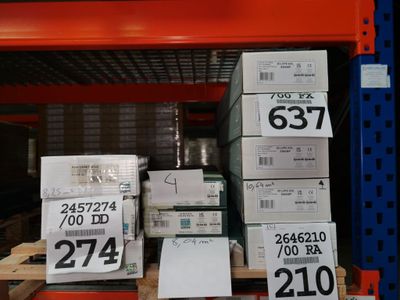 many boxes that are stacked on a shelf in a store