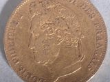 a close up of a gold coin with a woman ' s face on it