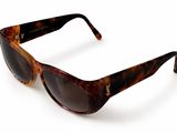 brown tortoise sunglasses on a white background on a white surface