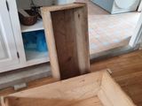a wooden box sitting on the floor in the kitchen