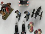 a lot of toy figurines that are on a table
