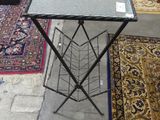 a table with a magazine rack on it in the middle of a room