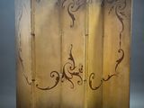 an image of a room divider with decorative designs on it