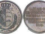 a close up of a coin with a crown on it