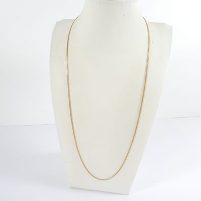 a close up of a mannequin with a necklace on it