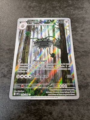 a close up of a pokemon card sitting on top of a table