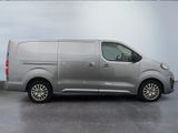 the silver van is parked in a parking lot with its door open