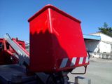 a large red container sitting on the back of a truck