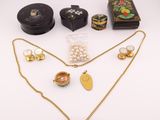a collection of jewellery including a necklace, earrings and a box