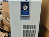 an image of a white machine sitting on top of a pile of boxes