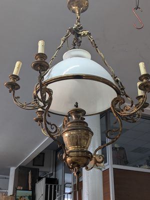 a chandelier hanging from the ceiling in a room