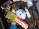 a black trash can filled with assorted items