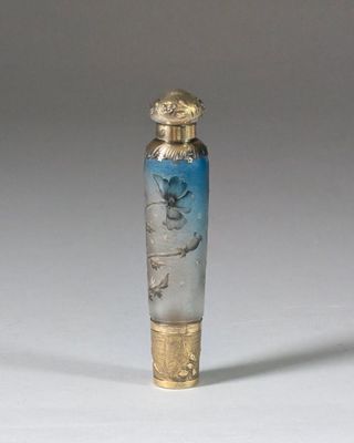 an image of a glass bottle with a bird on it
