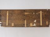 an old piece of wood with a piece of wood sticking out of it