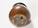 a close up view of a wooden salt and pepper shaker