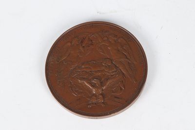 a close up of a penny on a white surface with a white background