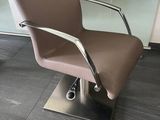 a brown chair that is sitting in front of a counter