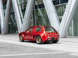 a red car that is parked in front of a building