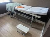 a white table with two sinks and a towel on it