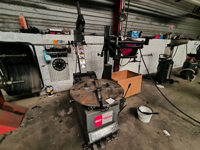 an image of a man working on a machine in a garage