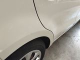 a white car that is parked in a garage